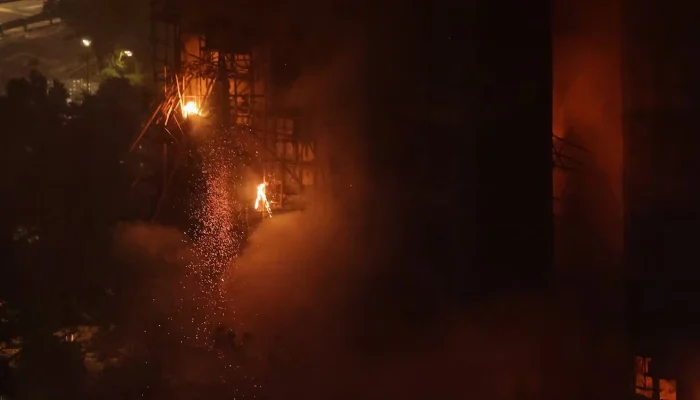 A fire burns bamboo scaffolding on a building at Wang Fuk Court housing estate, in Tai Po, Hong Kong, China, November 26. — Reuters