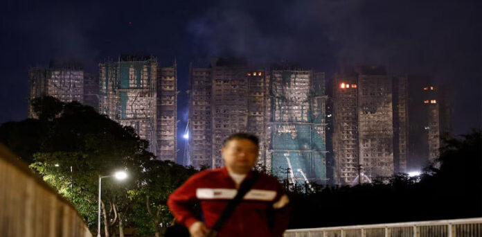 Hong Kong tower fire toll rises to 128, more arrests made