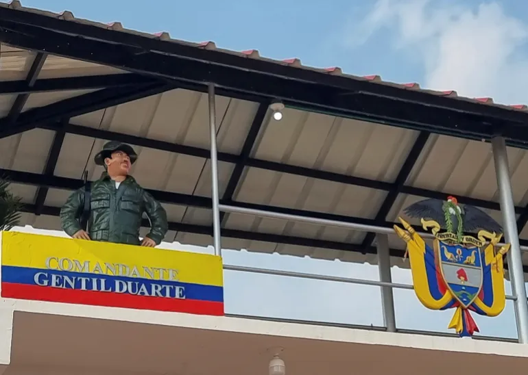 A statue stands on a platform of a school built by the EMC