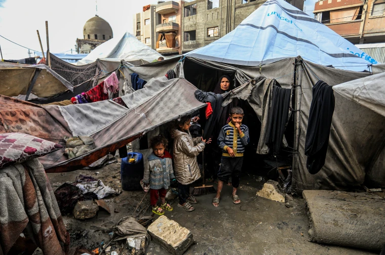 Displaced Palestinians struggle to survive during cold weather in Khan Yunis