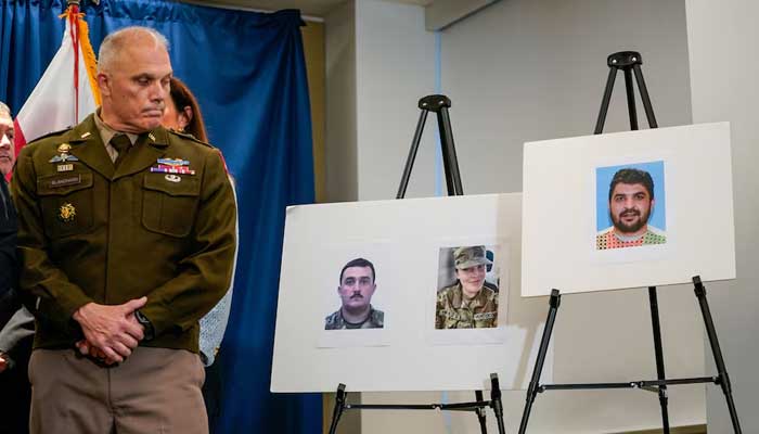 Pictures of two National Guard members and a picture of a suspect at a press conference in Washington, DC, US, November 27, 2025. — Reuters