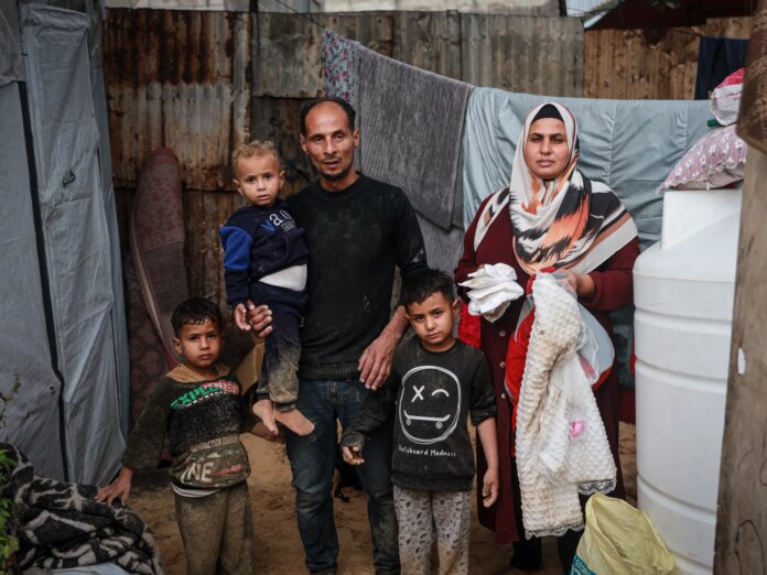 From war to winter: Gaza couple wait to welcome baby in flooded tent | Israel-Palestine conflict
