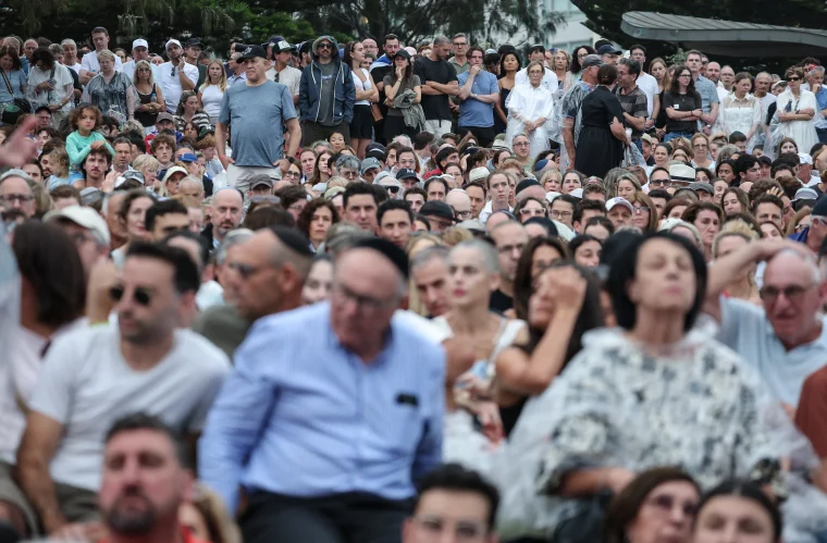 Mourners attend the memorial held for the victims of a shooting at Bondi Beach in Sydney on Dec. 21.