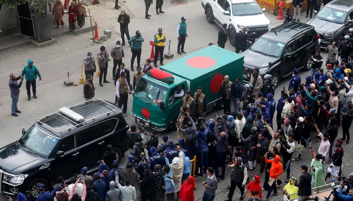 Security personnel escort a convoy carrying Bangladesh´s former prime minister Khaleda Zias mortal remains from Evercare hospital in Dhaka on December 31, 2025. — AFP