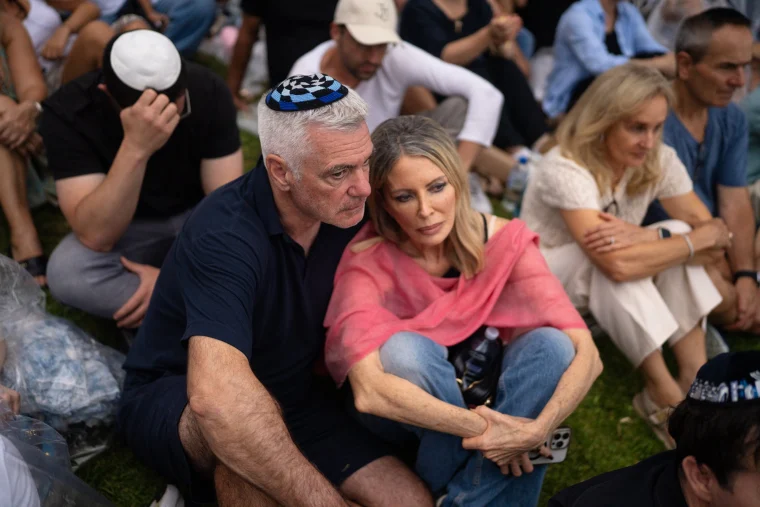 Thousands gather for a candlelight vigil on Dec. 21.