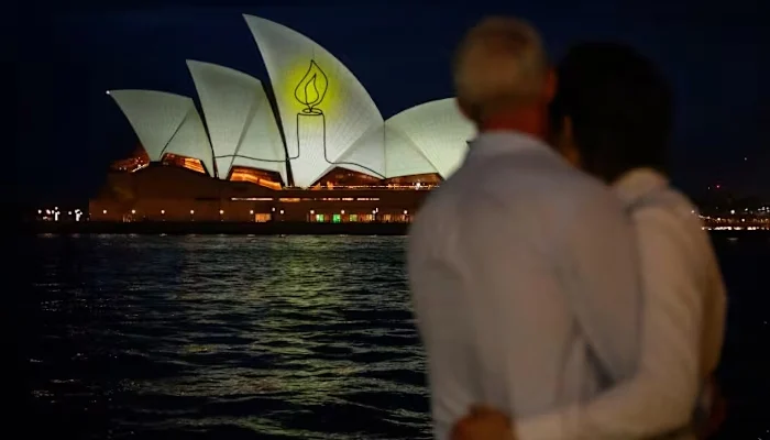 The Sydney Opera House is illuminated with candlelights in Sydney on Dec 21, 2025, as part of a national day of reflection honouring the victims of the Bondi Beach terrorist attack. — AFP