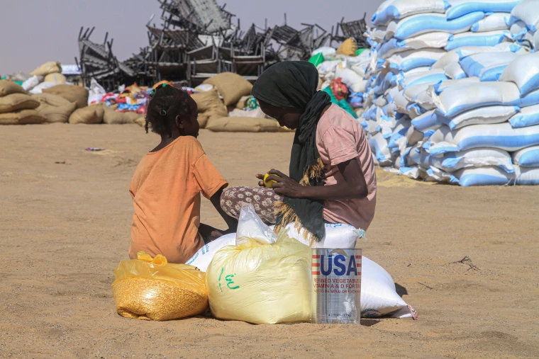 Sudanese girls who fled el-Fasher receive humanitarian aid at the al-Afad camp for displaced people in the town of al-Dabbah, northern Sudan, on Nov. 25.