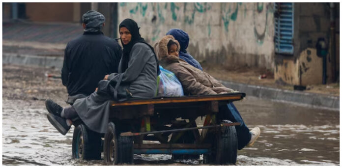 Torrential rain flooded Gaza tents and a baby died of exposure, medics say