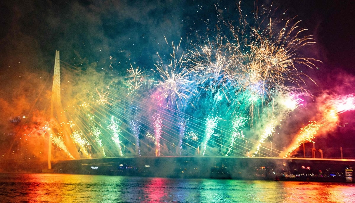 Fireworks explode over the Erasmus Bridge as part of New Year celebrations in Rotterdam on January 1, 2026. — AFP