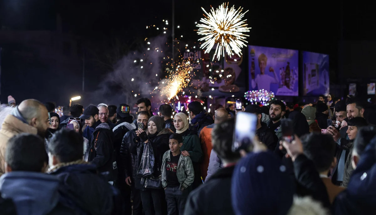 Residents of Damascus attend New Years Eve celebrations in the capitals Old City on December 31, 2025. — AFP