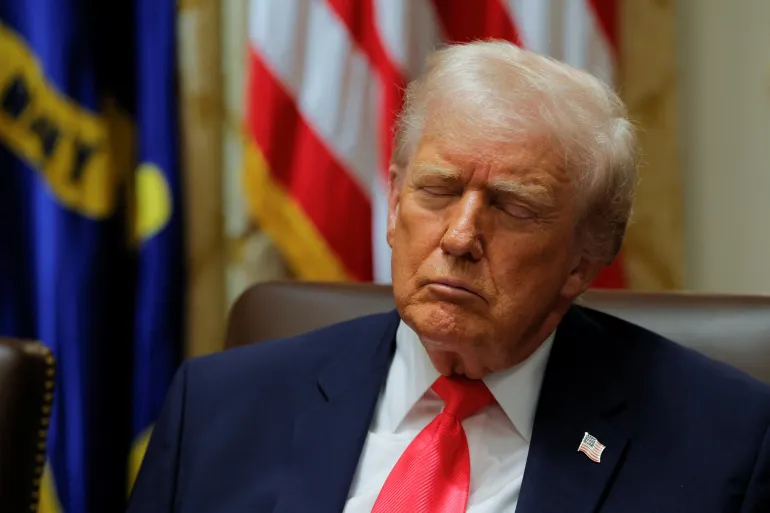 Trump closes his eyes while attending a cabinet meeting