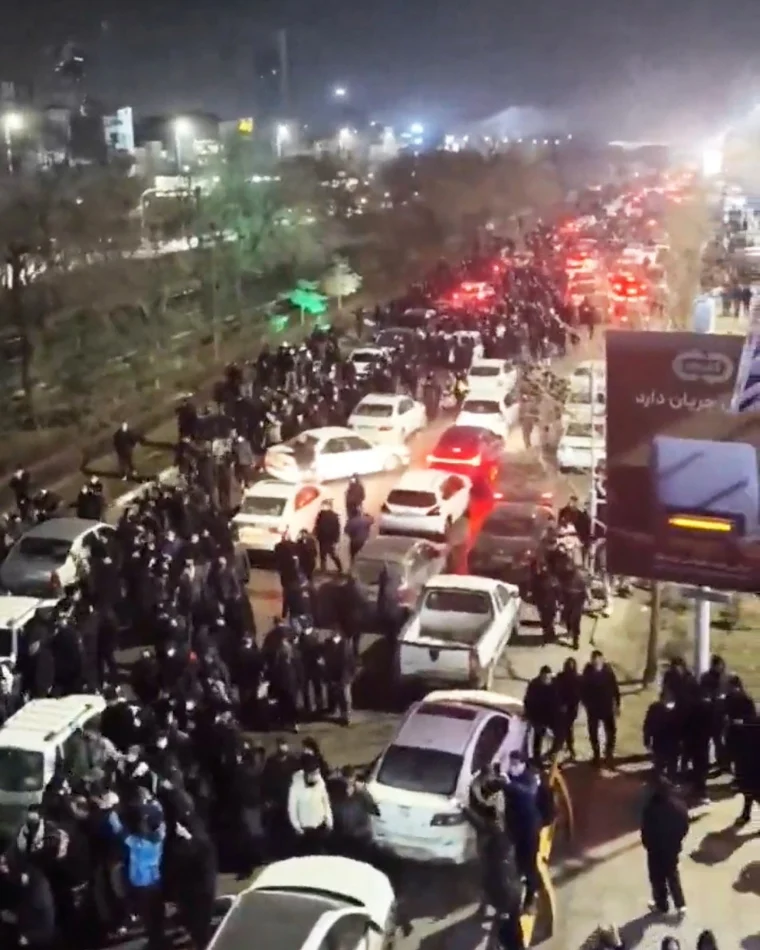 People gather on the streets during a protest in Mashhad