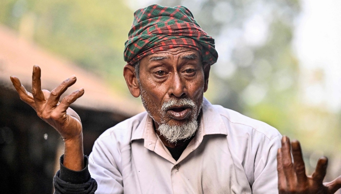 This photograph, taken on January 14, 2026, shows tricycle delivery driver Mohammad Shahjahan Fakir speaking during an interview with AFP in Gopalganj, Bangladesh. — AFP