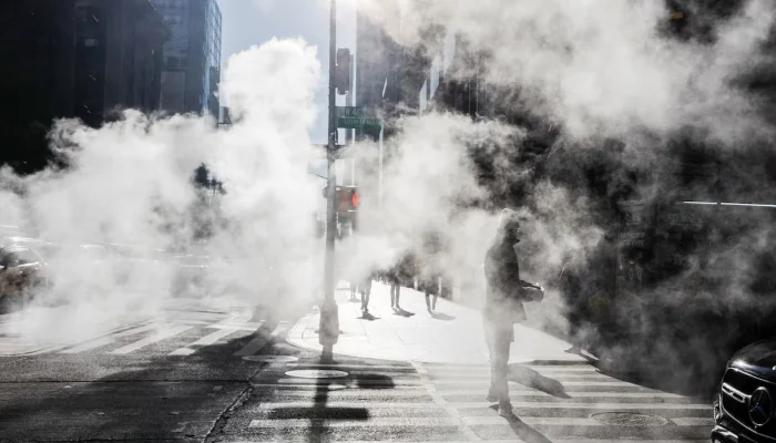 A pedestrian waits at a traffic light during cold weather in Midtown Manhattan, New York City, US, Jan. 21, 2026. — Reuters