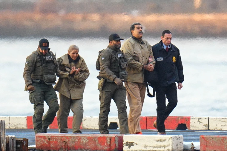 Former Venezuelan President Nicolas Maduro and his wife, Cilia Flores are escorted to a Federal courthouse in New York City earlier this month.