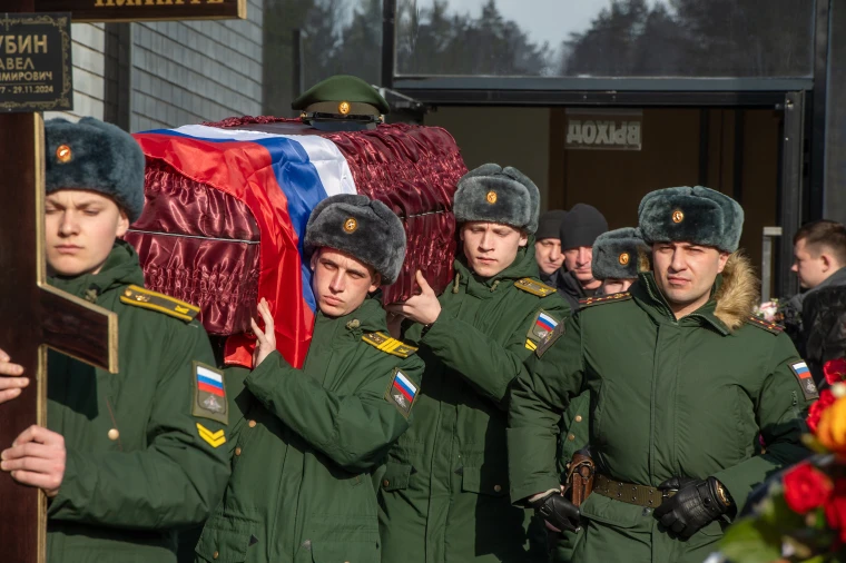Servicemen carry a coffin during the funeral of a serviceman of the Russian army