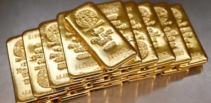 Gold leaps to record high, dollar drops as US prosecutors target Fed's Powell