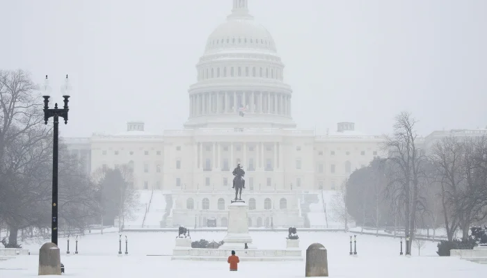 A view of the US Capitol as snow falls in Washington, DC, US, on January 25, 2026. — AFP