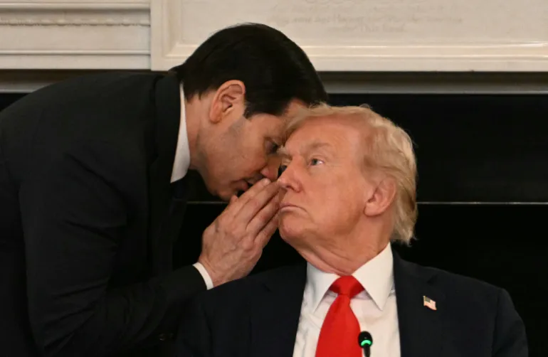 AFP PICTURES OF THE YEAR 2025 US Secretary of State Marco Rubio whispers in the ear of President Donald Trump during a roundtable about Antifa in the State Dining Room of the White House in Washington, DC, on October 8, 2025. (Photo by Jim WATSON / AFP) / NO USE AFTER JANUARY 31, 2026 23:00:00 GMT - AFP PICTURES OF THE YEAR 2025