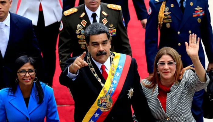 Venezuelas President Nicolas Maduro, flanked by his wife Cilia Flores and National Constituent Assembly President Delcy Rodriguez, arrives for a special session of the National Constituent Assembly to take oath as re-elected President at the Palacio Federal Legislativo in Caracas, Venezuela, May 24, 2018. — Reuters