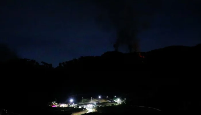 Smoke rises near Fort Tiuna, a military zone, during a full blackout, following explosions and loud noises, in Caracas, Venezuela, January 3, 2026. — Reuters