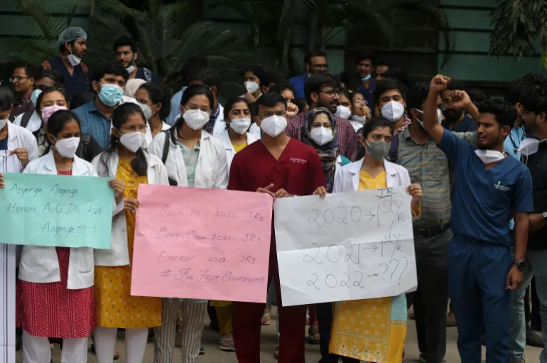 Osmania Medical College students shout slogans during a protest against the National Eligibility cum Entrance Test (NEET) PG counselling delay in Hyderabad, India, Friday, Dec. 3, 2021. (AP Photo/Mahesh Kumar A.)