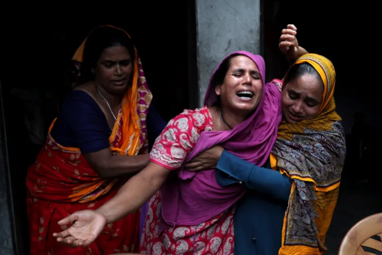 A woman mourns the death of her son who died during the previous day's violent clashes between supporters of ousted Prime Minister Sheikh Hasina and security forces in Gopalganj, Bangladesh, Thursday, July 17, 2025. (AP Photo/Abdul Goni)