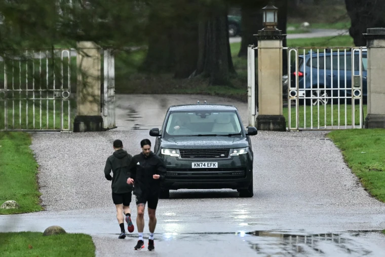 A car believed to be driven by Britain's Andrew Mountbatten-Windsor leaves the entrance to the Royal Lodge, a 30-room property where he has lived since 2003, at Windsor Great Park in Windsor on Feb. 1.