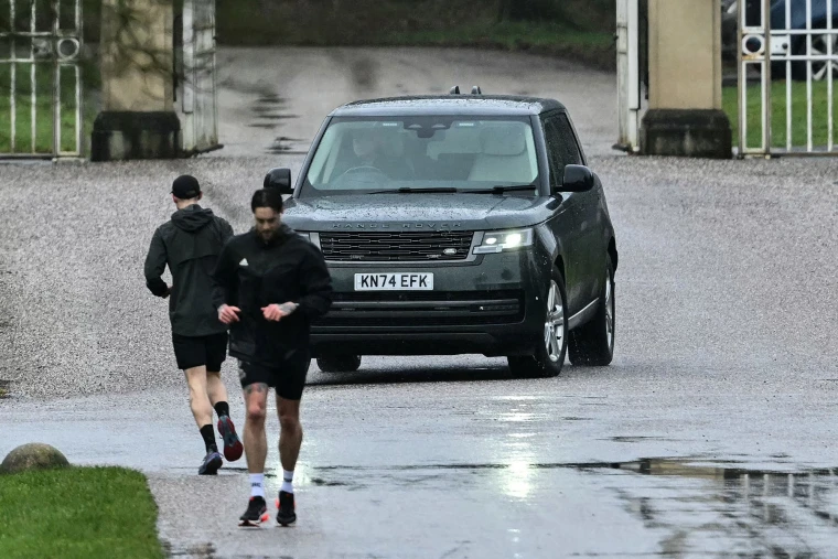 A car believed to be driven by Andrew Mountbatten-Windsor leaves the entrance to the Royal Lodge in Windsor on Feb. 1, 2026.