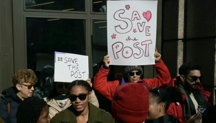Washington Post employees, along with supporters from the Washington-Baltimore News Guild, rally outside the Washington Post office building in Washington, DC, on February 5, 2026. — AFP