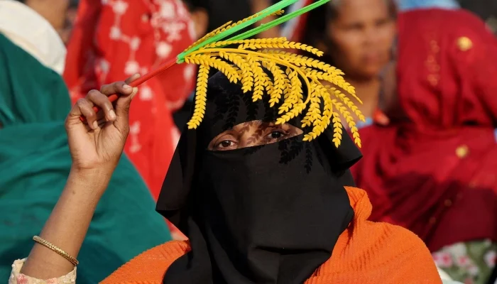 A woman supporting the Bangladesh Nationalist Party (BNP) holds a sheaf of paddy, the party’s electoral symbol, during an election campaign rally attended by the party chairman, Tarique Rahman, ahead of the national election, in Pallabi, Dhaka, Bangladesh, February 8, 2026. — Reuters