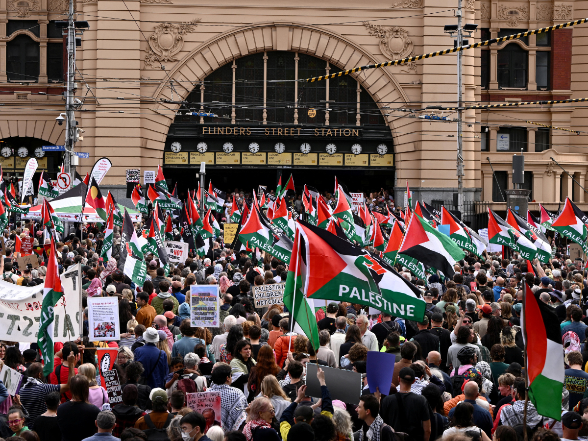 Demonstrators gather during a protest against Israeli President Isaac Herzog's visit to Australia, at Flinders Street Station in Melbourne, Australia, February 9, 2026. SOURCE: REUTERS