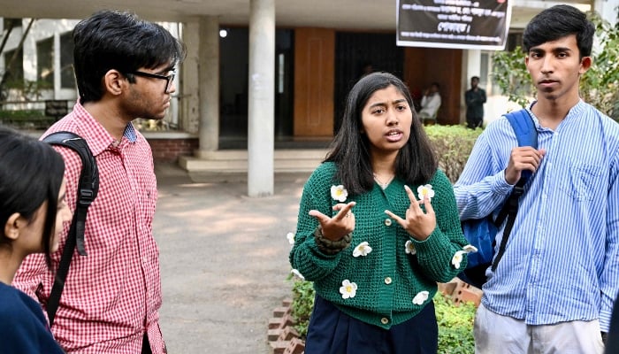 This photograph, taken on January 28, 2026, shows Dhaka University student and first-time voter Ariana Rahman (2R) talking to her friends inside their campus in Dhaka. Campaigning is in full swing in Bangladesh, but after decades defined by two women at the pinnacle of power, voters are heading to the polls with women largely absent from the race. — AFP