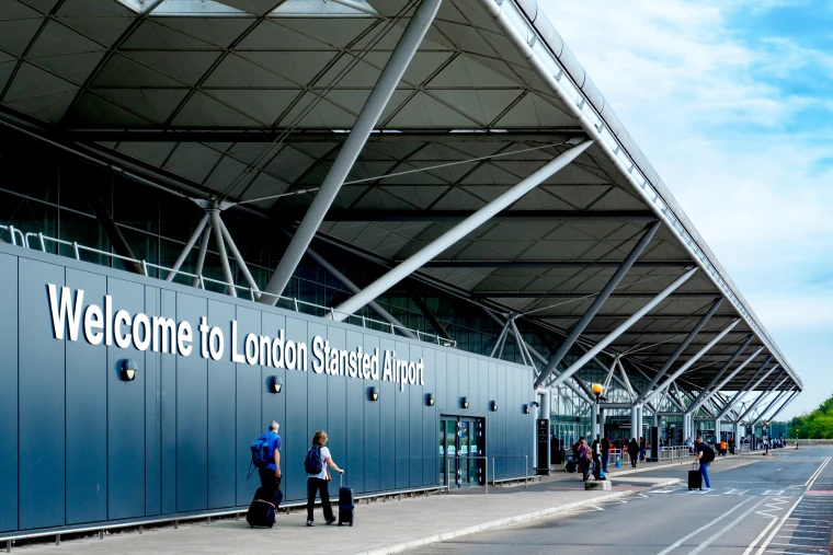 Passengers outside London Stansted Airport