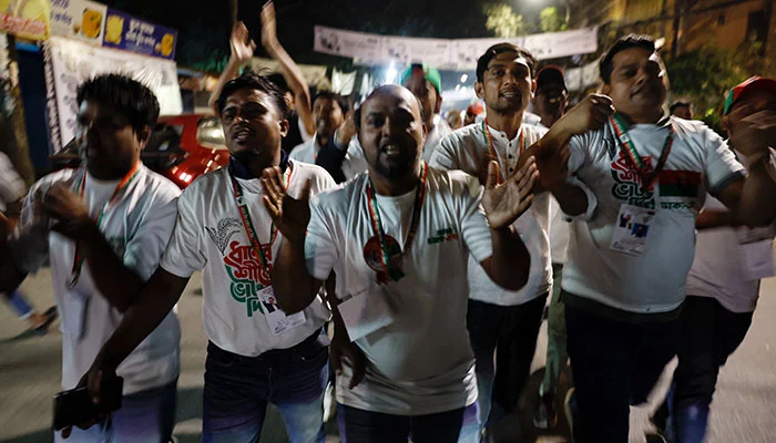 Supporters of the Bangladesh Nationalist Party (BNP) chant slogans as they celebrate unofficial news of Tarique Rahmans win in his constituency in the 13th general election near the partys Gulshan office in Dhaka, Bangladesh, February 12, 2026. — Reuters