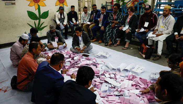 Electoral workers sort the ballots before counting the votes, during the 13th general election in Dhaka, Bangladesh, February 12, 2026. — Reuters