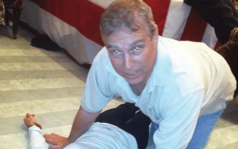 A photograph from the latest Epstein document release appears to show the then-Prince Andrew kneeling over an unknown woman.