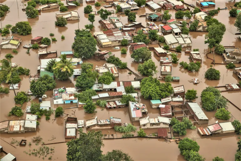 epa12664695 An aerial view shows the flooded 03 February neighbourhood between the Maputo and Gaza regions, Maputo, Mozambique, 20 January 2026. Rescue efforts continue for hundreds of families cut off by flooding, with some taking refuge on rooftops, car roofs, or in treetops in southern Mozambique after days of near-continuous rain that has also forced dams, including some in neighbouring countries, to increase water releases. EPA/LUISA NHANTUMBO