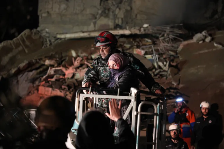 A woman who survived an Israeli airstrike is rescued by a firefighter from a destroyed building in central Beirut, Lebanon, Wednesday, April 8, 2026. (AP Photo/Emilio Morenatti)