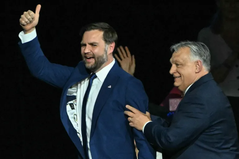 US Vice President JD Vance (L) and Hungarian Prime Minister Viktor Orban appear on stage together during a "Day of Friendship" event at MTK Sportpark in Budapest, Hungary on April 7, 2026.