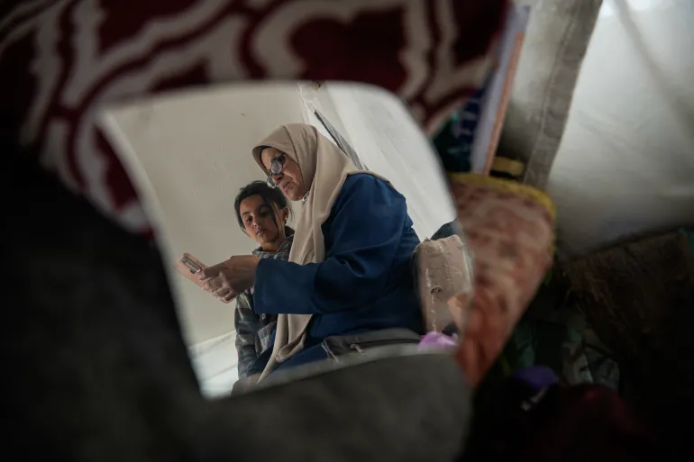 Ina’am feels deep anxiety about the lives of her imprisoned sons amid escalating conditions in the prisons and the approval of a law enabling the execution of prisoners in Israeli jails [Omar Ashtawy/ Al Jazeera]