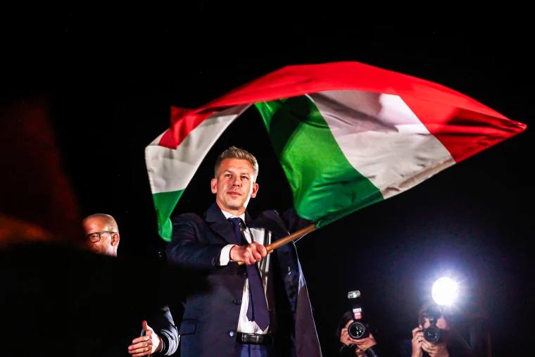 New Prime Minister of Hungary Peter Magyar waves a Hungarian