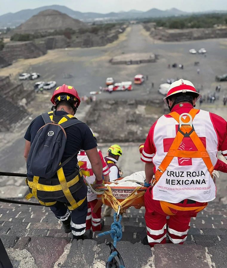 Red Cross personnel transport a body at the Pyramid of the Moon following a shooting in Teotihuacan, Mexico, on April 20, 2026. 