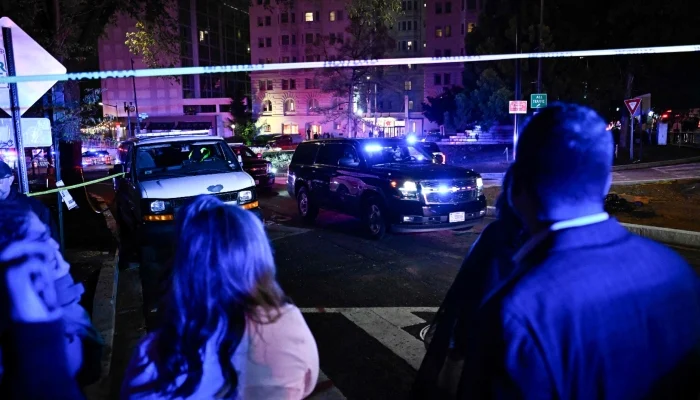 Vehicles are seen leaving the Washington Hilton after shots were heard during the White House Correspondents´ Dinner in Washington, DC, on April 25, 2026. — AFP
