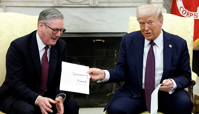 US President Donald Trump holds a letter from Britains King Charles as he meets with British Prime Minister Keir Starmer in the Oval Office at the White House in Washington, DC, US, February 27, 2025. — Reuters