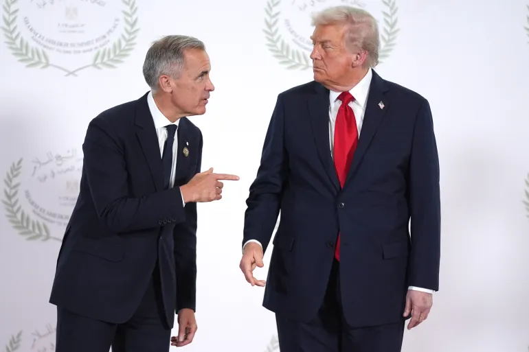SHARM EL-SHEIKH, EGYPT - OCTOBER 13: President Donald Trump greets Canada's Prime Minister Mark Carney during a world leaders' summit on ending the Gaza war on October 13, 2025 in Sharm El-Sheikh, Egypt. President Trump is in Egypt to meet with European and Middle Eastern leaders in what’s being billed as an international peace summit, following the start of a US-brokered ceasefire deal to end the war in the Gaza Strip. (Photo by Evan Vucci - Pool / Getty Images)