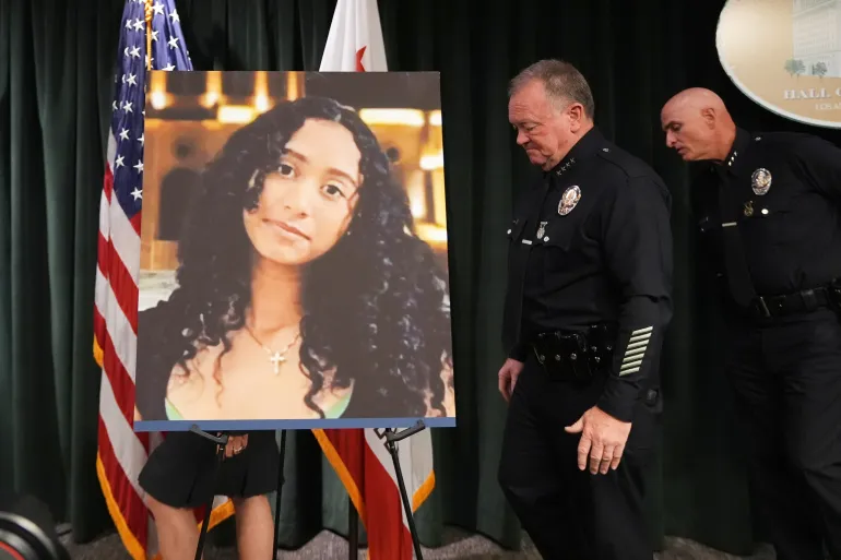 LAPD Chief Jim McDonnell walks past an image of Celeste Rivas Hernandez Monday