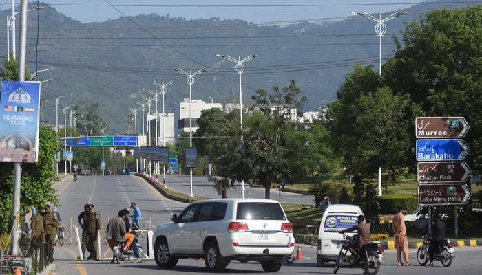 Security personnel check vehicles at a checkpoint near Serena Hotel following USand Iran peace talks in Islamabad on April 12, 2026. — Reuters