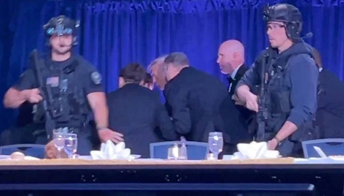 US President Donald Trump is escorted out as a shooter opens fire during the annual White House Correspondents Association dinner in Washington, DC, US, April 25, 2026, in this screen capture from video. — Reuters