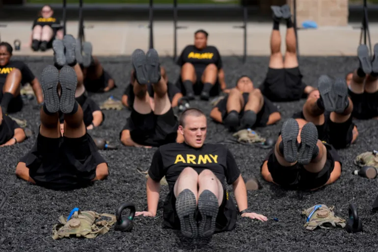 soldiers exrcise in black shirts reading 'ARMY'